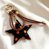 bag charm met opvallende ster